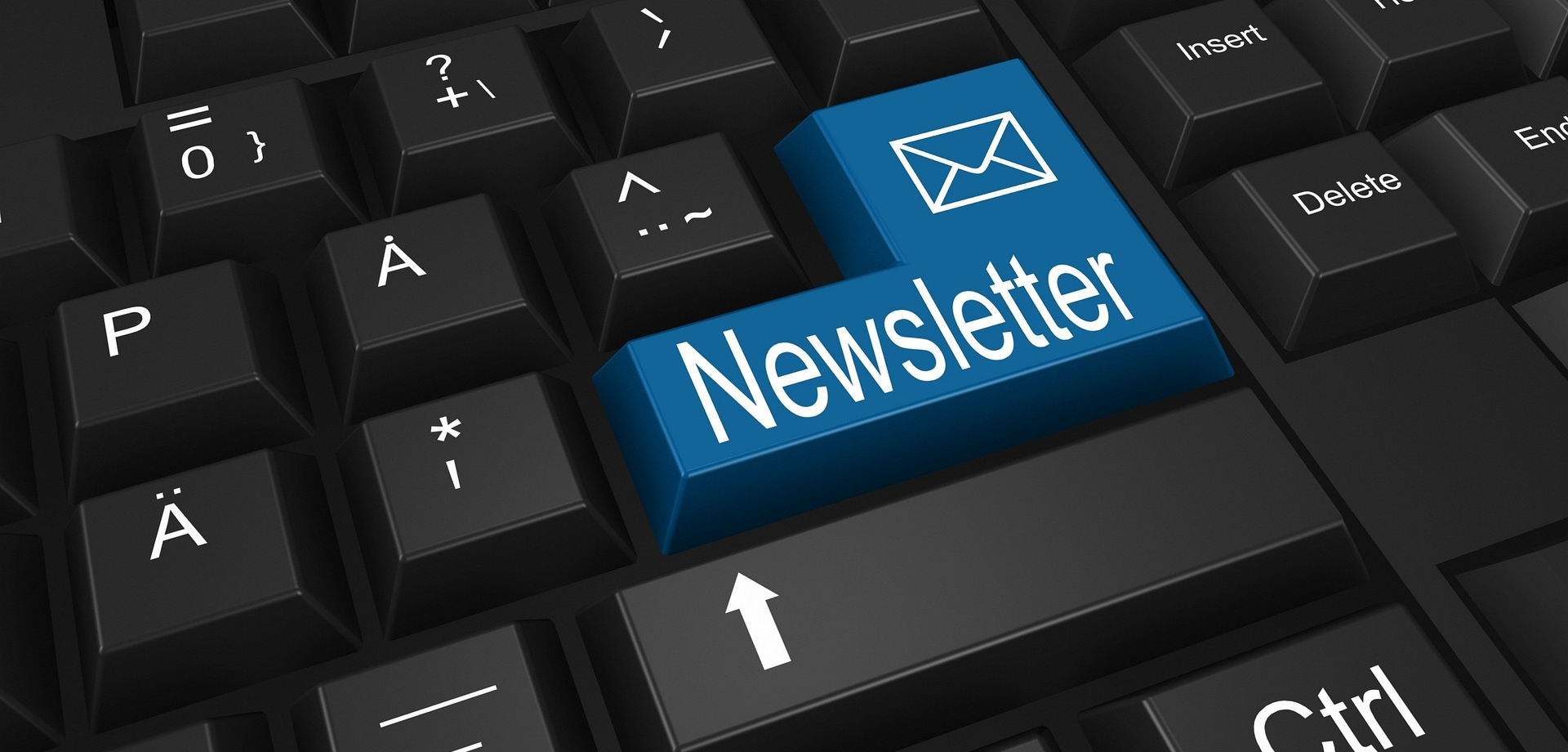 Eine Tastatur mit einem blauen Button mit der Aufschrift "Newsletter".